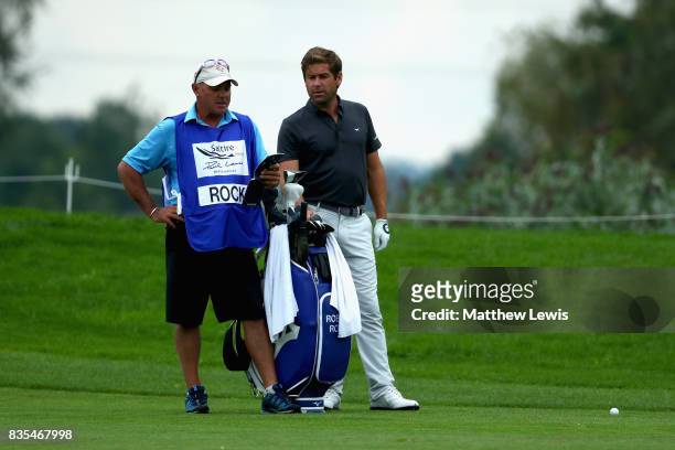 Robert Rock of England speaks with his caddie on the 5th during day three of the Saltire Energy Paul Lawrie Matchplay at Golf Resort Bad Griesbach on...