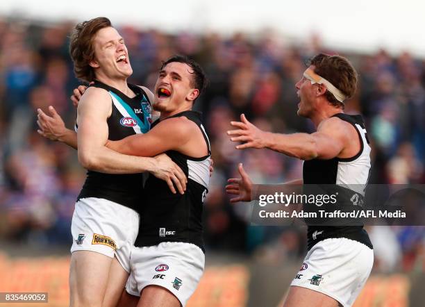 Jared Polec of the Power celebrates a goal with Sam Powell-Pepper and Brad Ebert of the Power during the 2017 AFL round 22 match between the Western...