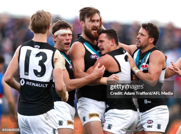 Charlie Dixon of the Power celebrates a goal with Brad Ebert, Sam Powell-Pepper and Travis Boak of the Power during the 2017 AFL round 22 match...