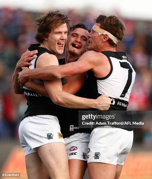 Jared Polec of the Power celebrates a goal with Sam Powell-Pepper and Brad Ebert of the Power during the 2017 AFL round 22 match between the Western...