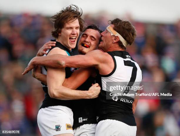 Jared Polec of the Power celebrates a goal with Sam Powell-Pepper and Brad Ebert of the Power during the 2017 AFL round 22 match between the Western...