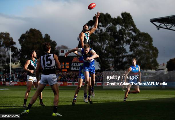 Paddy Ryder of the Power attempts to mark over Jordan Roughead of the Bulldogs during the 2017 AFL round 22 match between the Western Bulldogs and...