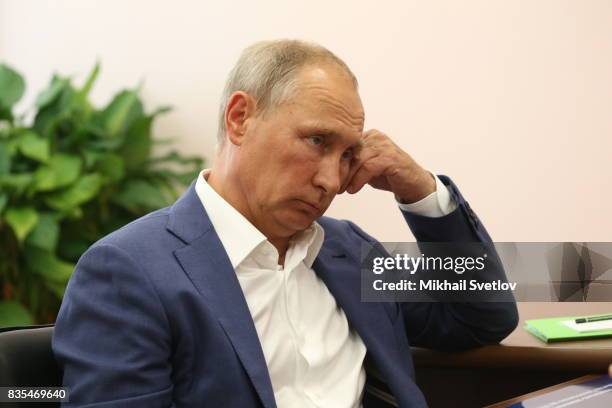 Russian President Vladimir Putin is seen during his meeting with Governor of Sevastopol Dmitry Ovsyannikov on August 18, 2017 on Sevastopol, Crimea....