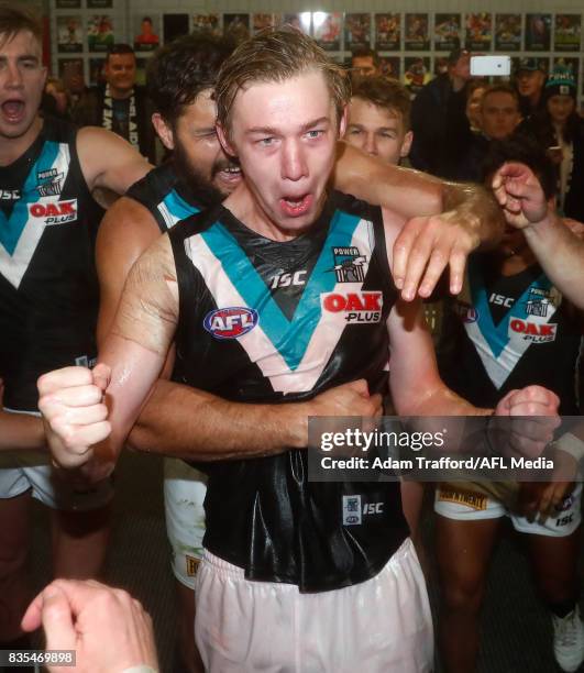 Debutant, Todd Marshall of the Power sings the team song after his first win during the 2017 AFL round 22 match between the Western Bulldogs and the...