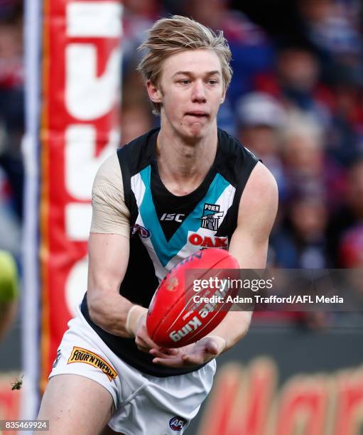 Debutant, Todd Marshall of the Power handpasses the ball during the 2017 AFL round 22 match between the Western Bulldogs and the Port Adelaide Power...