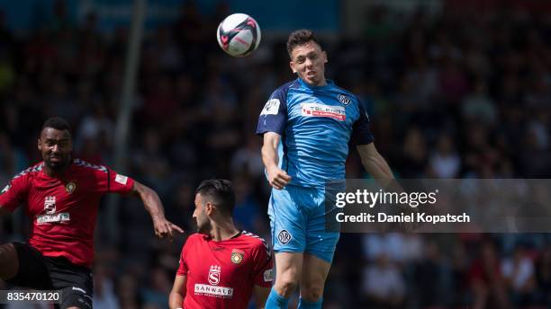 Marcel Baer of Aalen jumps for a header during the 3. Liga match between SG Sonnenhof Grossaspach and VfR Aalen at on August 19, 2017 in Grossaspach,...