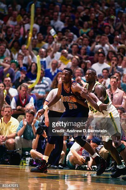 Dikembe Mutombo of the Denver Nuggets posts up against Shawn Kemp of the Seattle Supersonics during Game Five of the Western Conference Quarterfinals...
