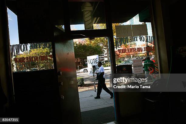 Man walks past a barber shop in the Civil Rights District, an area notable for several significant events in the civil rights movement, November 3,...