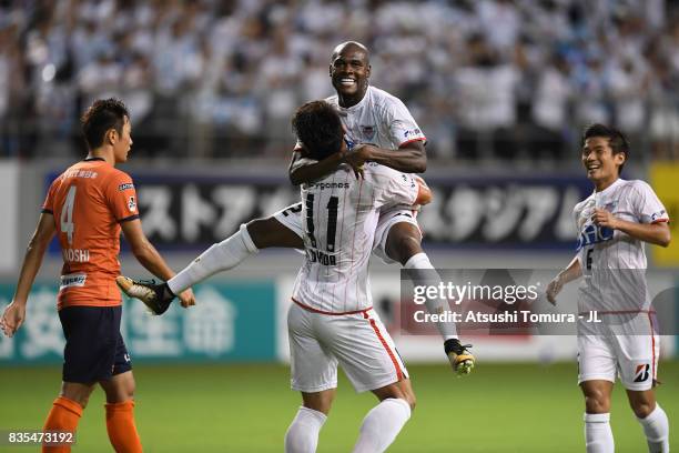 Victor Ibarbo of Sagan Tosu celebrates scoring his side's second goal with his team mate Yohei Toyoda during the J.League J1 match between Sagan Tosu...