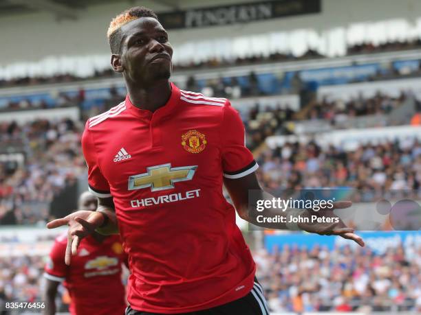 Paul Pogba of Manchester United celebrates scoring their third goal during the Premier League match between Swansea City and Manchester United at...