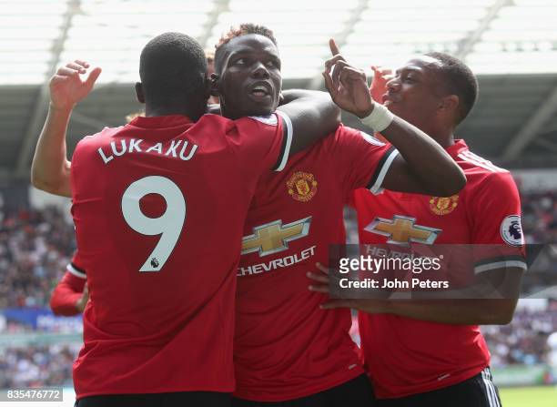Paul Pogba of Manchester United celebrates scoring their third goal during the Premier League match between Swansea City and Manchester United at...