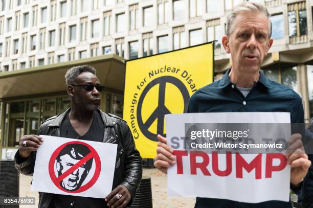 Activists from Stand Up To Trump gather outside the US Embassy on August 19, 2017 in London, England. Anti-Trump protest against Donald Trump's...