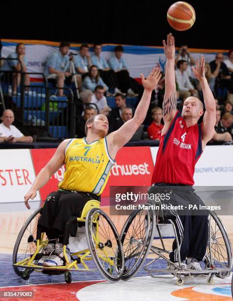Great Britain's Joe Bestwick shoots against Australia's Shaun Norris during the Wheelchair Basketball match at the Manchester Regional Arena during...