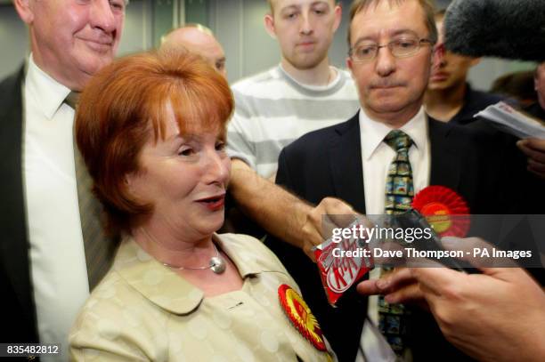 Member of the BNP offers a KitKat in front of MP Hazel Blears after Labour candidate Matt Mold won the Irwell Riverside by-election.