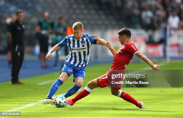 Mitchell Weiser of Hertha BSC Berlin and Josip Brekalo of VfB Stuttgart during the Bundesliga match between Hertha BSC and VfB Stuttgart at...