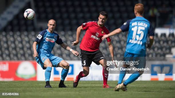 Matthias Morys of Aalen is challenged by Julian Leist of Grossaspach during the 3. Liga match between SG Sonnenhof Grossaspach and VfR Aalen at on...