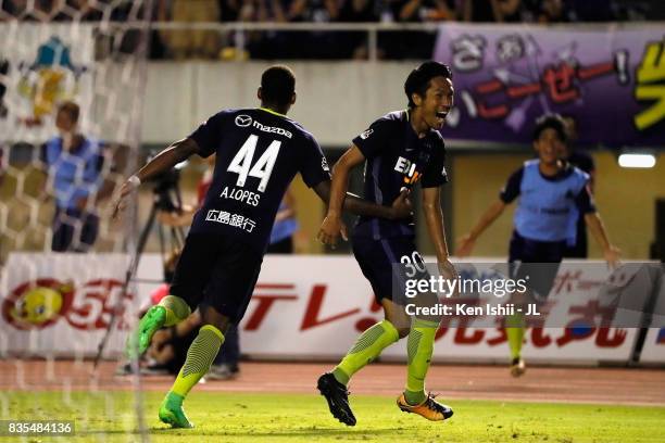 Kosei Shibasaki of Sanfrecce Hiroshima celebrates scoring the opening goal with his team mate Anderson Lopes during the J.League J1 match between...