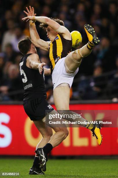Sam Docherty of the Blues and Taylor Duryea of the Hawks compete for the ball during the round 22 AFL match between the Carlton Blues and the...