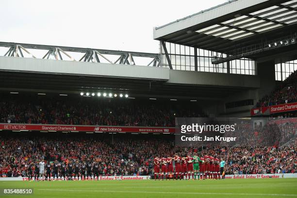 Fans, players and officals take part in a minute of applause for the victims of the Barcelona terror attack prior to the Premier League match between...