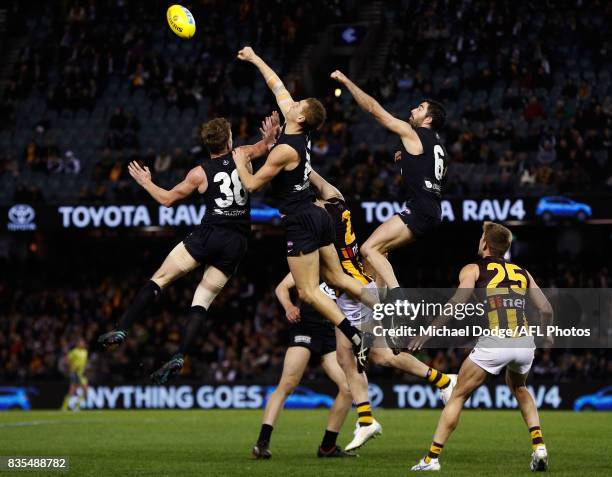 Liam Jones of the Blues spoils Jarryd Roughead of the Hawks during the round 22 AFL match between the Carlton Blues and the Hawthorn Hawks at Etihad...