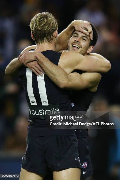 Sam Kerridge of the Blues and Blaine Boekhorst of the Blues celebrate the win during the round 22 AFL match between the Carlton Blues and the...