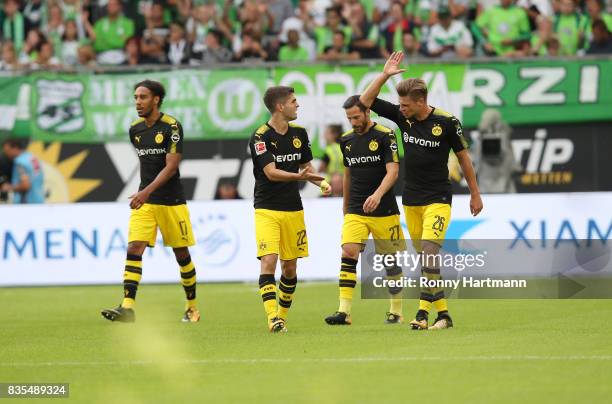 Christian Pulisic of Borussia Dortmund is congratulated by Lukasz Piszczek of Borussia Dortmund after he scored the first goal during the Bundesliga...