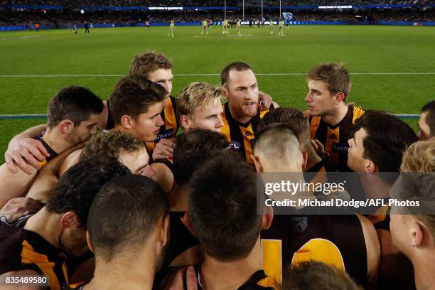 Jarryd Roughead of the Hawks speaks to teammates during the round 22 AFL match between the Carlton Blues and the Hawthorn Hawks at Etihad Stadium on...