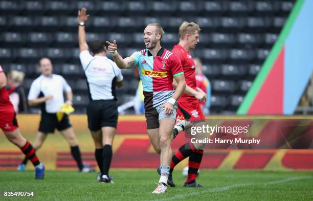 Charlie Walker of Harlequins celebrates scoring his teams first try during the pre season match between Harlequins and Jersey Red at the Twickenham...