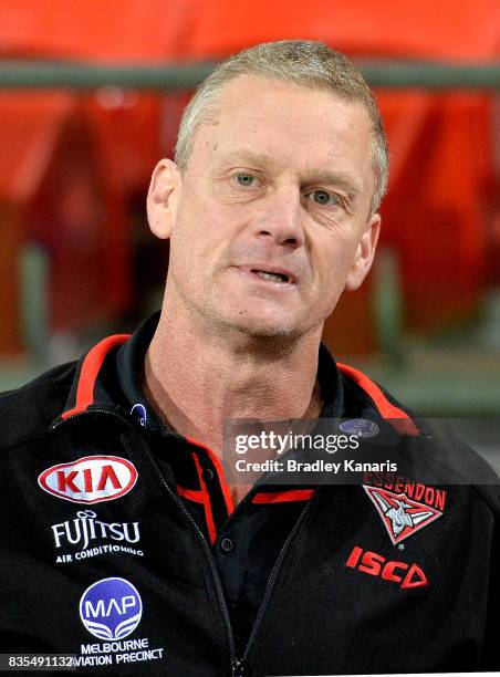 Bombers Assistant Coach Guy McKenna is seen during the round 22 AFL match between the Gold Coast Suns and the Essendon Bombers at Metricon Stadium on...