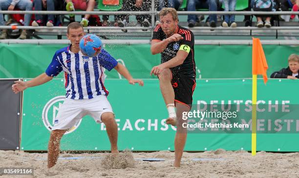 Players of Hertha BSC and Hamburger SV battle for the ball on day 1 of the 2017 German Beach Soccer Championship on August 19, 2017 in Warnemunde,...