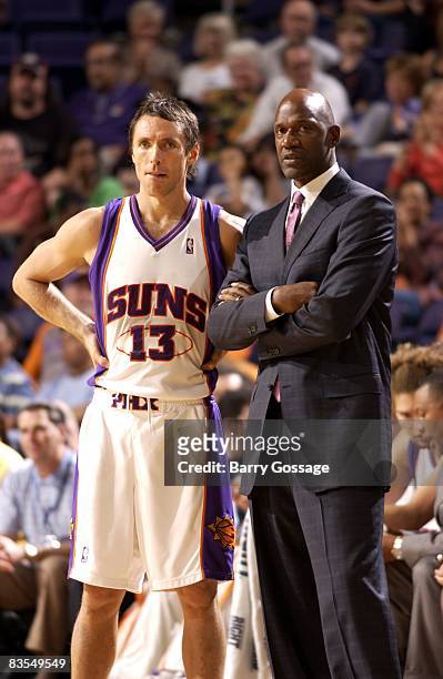 Steve Nash and head coach Terry Porter of the Phoenix Suns look on from the sideline during a preseason game against the Oklahoma City Thunder at...