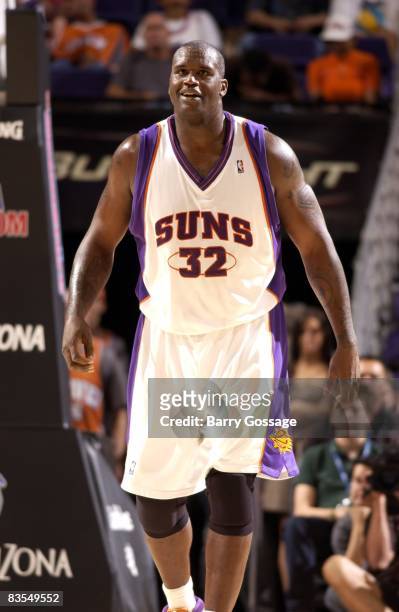 Shaquille O'Neal of the Phoenix Suns looks on with a smile during a preseason game against the Oklahoma City Thunder at U.S. Airway Center on October...