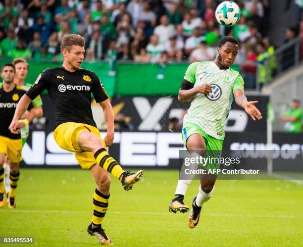 Dortmund's Polish defender Lukasz Piszczek and Wolfsburg's English forward Kaylen Hinds during the German First division Bundesliga football match...