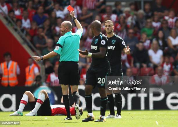 Marko Arnautovic of West Ham United is shown a red card by referee Lee Mason during the Premier League match between Southampton and West Ham United...