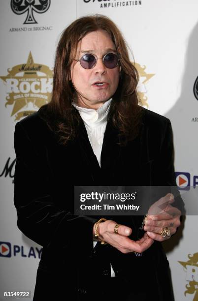 Singer Ozzy Osbourne poses with his Living Legend Award, presented to him at the Classic Rock Roll of Honour Awards on November 3, 2008 at the Park...