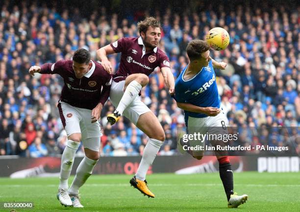 Rangers Ryan Jack and Hearts Connor Randall battle for the ball during the Scottish Premiership match at Ibrox, Glasgow.