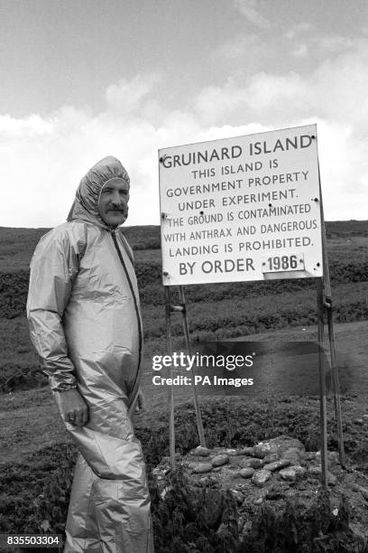 Malcolm Broster of MOD Chemical Defence Establishment at Porton Down, alongside one of the warning signs on the Gruinard Island, which has been...