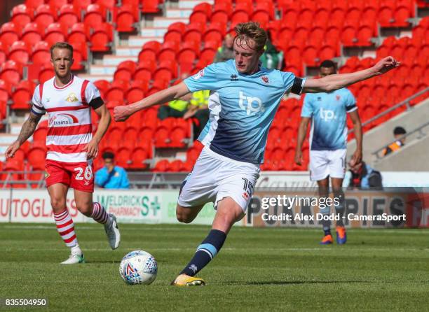 Blackpool's Sean Longstaff scores his sides equalising goal to make the score 1-1 with a long range effort during the Sky Bet League One match...