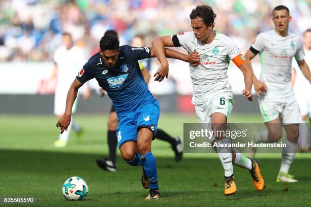 Nadiem Amiri of TSG 1899 Hoffenheim and Thomas Delaney of Werder Bremen during the Bundesliga match between TSG 1899 Hoffenheim and SV Werder Bremen...