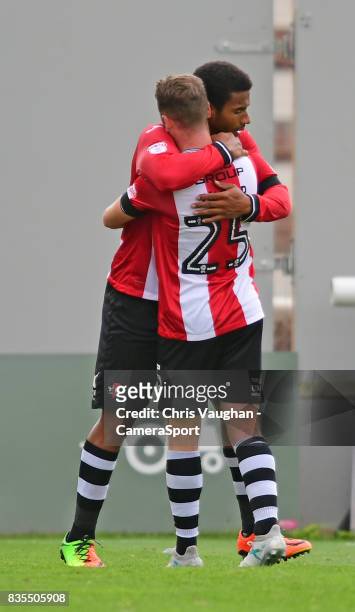 Exeter City's Reuben Reid celebrates scoring the opening goal with team-mate Jake Taylor during the Sky Bet League Two match between Exeter City and...