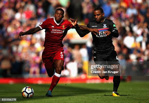 Georginio Wijnaldum of Liverpool and Jason Puncheon of Crystal Palace battle for possession during the Premier League match between Liverpool and...