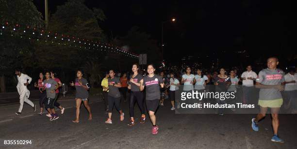 Women participate in Colors Pinkathon Delhi, 'Fearless Midnight Women's run', along with Delhi Police as one of the participants, organised at Inner...