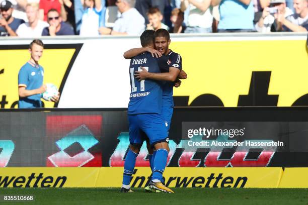 Andrej Kramaric of TSG 1899 Hoffenheim is celebrated by Steven Zuber of TSG 1899 Hoffenheim after he scored to make it 1:0 during the Bundesliga...