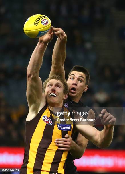 Matthew Kreuzer of the Blues and Ben McEvoy of the Hawks compete for the ball during the round 22 AFL match between the Carlton Blues and the...