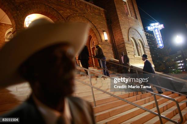 People enter the historic Sixteenth Street Baptist Church for a Southern Christian Leadership Conference rally where speakers encouraged people to...