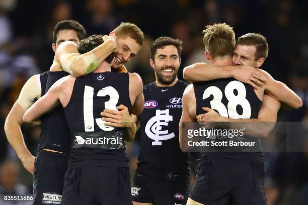 The Blues celebrate at the final siren and winning the round 22 AFL match between the Carlton Blues and the Hawthorn Hawks at Etihad Stadium on...