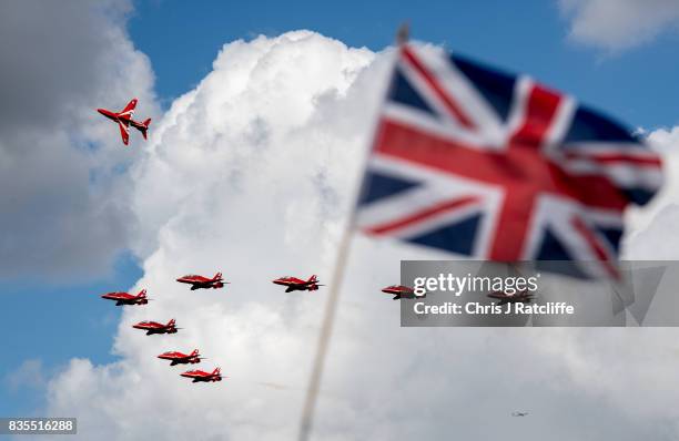 The Royal Air Force Red Arrows fly past a Union Jack whilst departing for another air show at the Biggin Hill Festival of Flight on August 19, 2017...