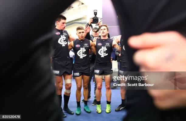 Jarrod Pickett of the Blues and Marc Murphy of the Blues sing the song in the rooms after winning during the round 22 AFL match between the Carlton...