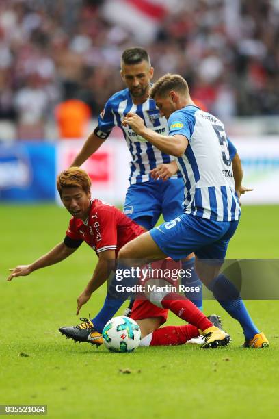 Takuma Asano of VfB Stuttgart and Niklas Stark of Hertha BSC Berlin and Vedad Ibisevic of Hertha BSC Berlin during the Bundesliga match between...