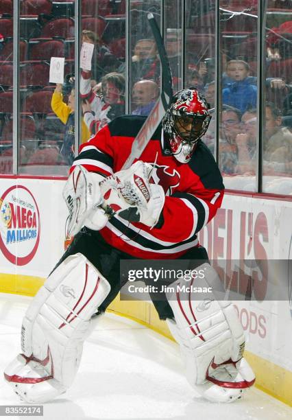 Kevin Weekes of the New Jersey Devils clears the puck against the Buffalo Sabres at the Prudential Center on November 3, 2008 in Newark, New Jersey.